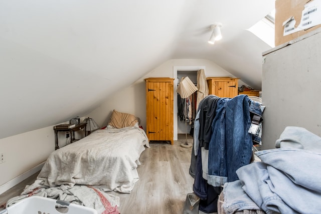 20 Elmwood Ave, Westbrook, ME 04092 - bedroom with vaulted ceiling and light wood finished floors
