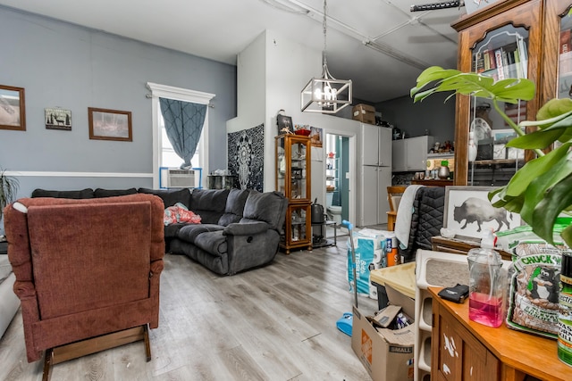 20 Elmwood Ave, Westbrook, ME 04092 - living room featuring a chandelier, light wood-type flooring, and cooling unit