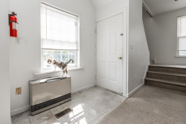 20 Elmwood Ave, Westbrook, ME 04092 - entryway featuring heating unit and stairway