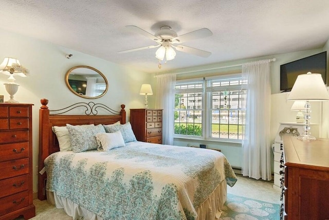 1801 Post Rd Unit 110, Wells, ME 04090 - bedroom featuring light carpet and ceiling fan
