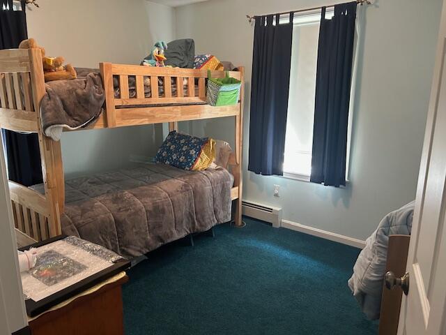 60 Dawes Rd, Dover-Foxcroft, ME 04426 - carpeted bedroom with baseboard heating and baseboards