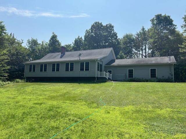 60 Dawes Rd, Dover-Foxcroft, ME 04426 - rear view of property with a yard and a chimney