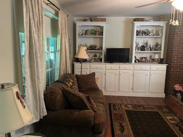 60 Dawes Rd, Dover-Foxcroft, ME 04426 - living room with dark wood finished floors
