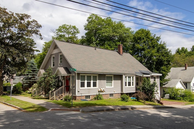 99 Gamage Ave, Auburn, ME 04210 - view of front facade featuring a chimney