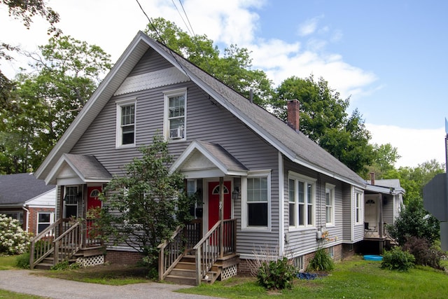 99 Gamage Ave, Auburn, ME 04210 - view of front of house with a shingled roof and a front lawn