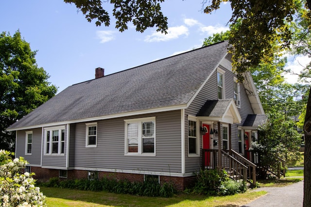 99 Gamage Ave, Auburn, ME 04210 - view of side of property with a shingled roof and a chimney