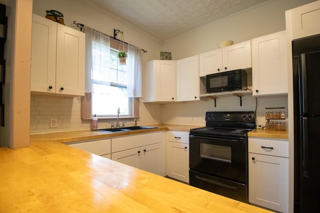 99 Gamage Ave, Auburn, ME 04210 - kitchen featuring black appliances, wood counters, decorative backsplash, white cabinetry, and ornamental molding