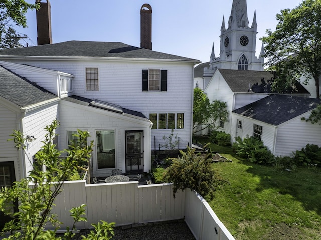 12 Center St, Machias, ME 04654 - rear view of house featuring a chimney and a shingled roof