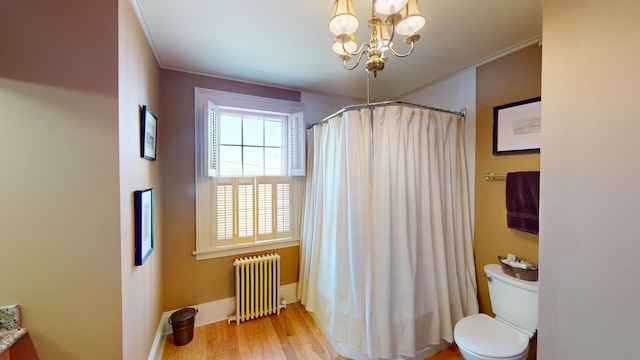 12 Center St, Machias, ME 04654 - bathroom with radiator heating unit, a chandelier, wood finished floors, crown molding, and curtained shower