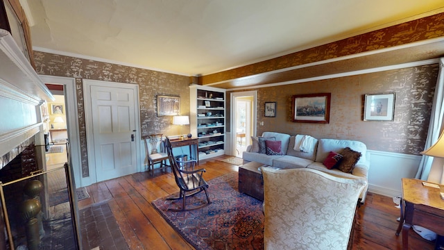 12 Center St, Machias, ME 04654 - living room featuring wallpapered walls, hardwood / wood-style flooring, a fireplace, crown molding, and a wainscoted wall