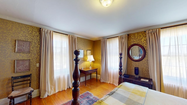 12 Center St, Machias, ME 04654 - bedroom featuring wood finished floors, multiple windows, wallpapered walls, and crown molding
