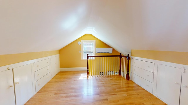 12 Center St, Machias, ME 04654 - bonus room with an AC wall unit, vaulted ceiling, and light wood-type flooring