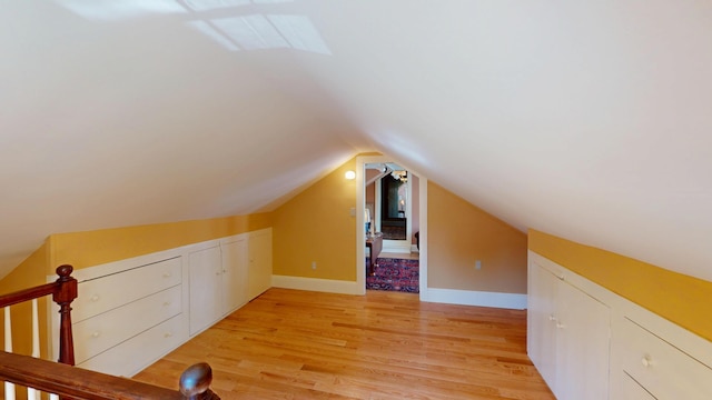 12 Center St, Machias, ME 04654 - additional living space featuring light wood-style floors, vaulted ceiling, and a skylight