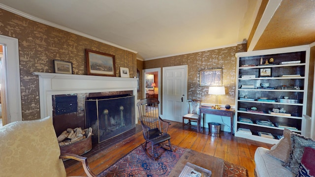 12 Center St, Machias, ME 04654 - living area featuring wallpapered walls, wood-type flooring, a fireplace, and crown molding