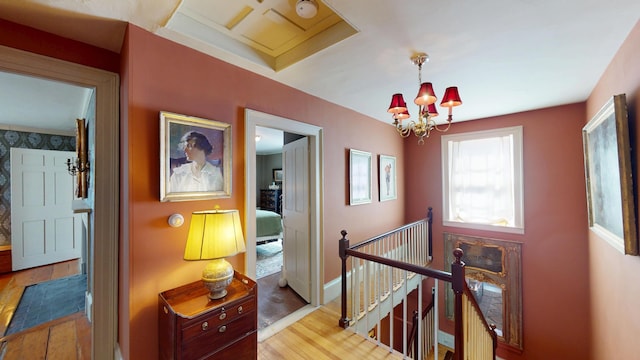 12 Center St, Machias, ME 04654 - hallway featuring an upstairs landing, wood finished floors, and a chandelier