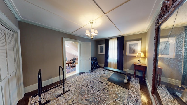 12 Center St, Machias, ME 04654 - foyer entrance featuring wood finished floors, a chandelier, and crown molding