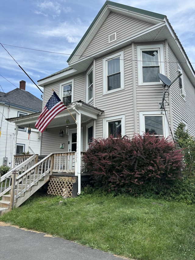 293 Grove St, Bangor, ME 04401 - townhome / multi-family property featuring a front yard and covered porch