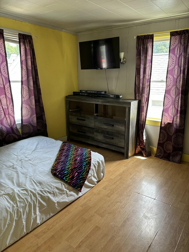293 Grove St, Bangor, ME 04401 - bedroom featuring multiple windows and wood finished floors