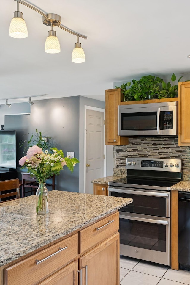 19 Straw Rd, Gorham, ME 04038 - kitchen with appliances with stainless steel finishes, tasteful backsplash, light tile patterned floors, and light stone counters