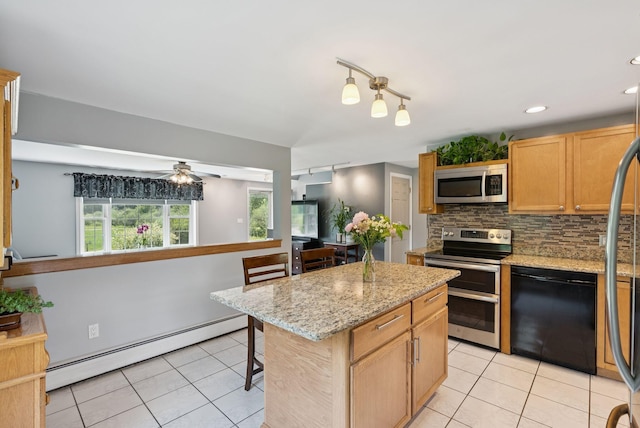 19 Straw Rd, Gorham, ME 04038 - kitchen with stainless steel appliances, a baseboard radiator, light tile patterned floors, backsplash, and recessed lighting