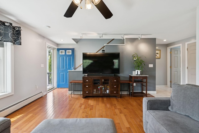 19 Straw Rd, Gorham, ME 04038 - living area with a baseboard radiator, ceiling fan, wood-type flooring, rail lighting, and recessed lighting