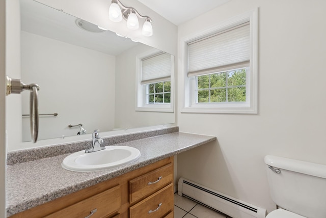 19 Straw Rd, Gorham, ME 04038 - half bath featuring a baseboard heating unit, vanity, and tile patterned floors
