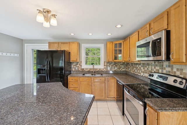 19 Straw Rd, Gorham, ME 04038 - kitchen featuring stainless steel appliances, decorative backsplash, light tile patterned flooring, recessed lighting, and dark stone counters