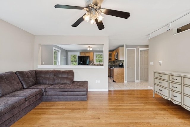 19 Straw Rd, Gorham, ME 04038 - living room featuring light wood-style flooring, ceiling fan, and track lighting