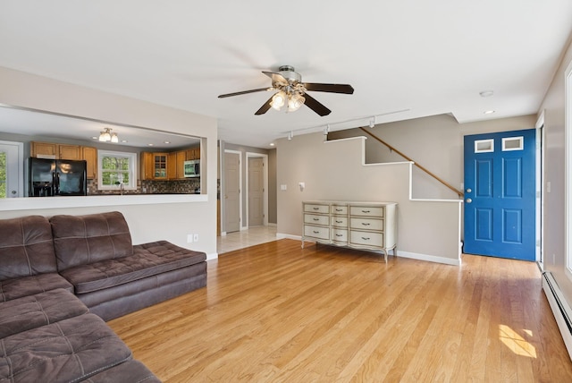 19 Straw Rd, Gorham, ME 04038 - living room with a ceiling fan, light wood-type flooring, baseboard heating, recessed lighting, and stairway