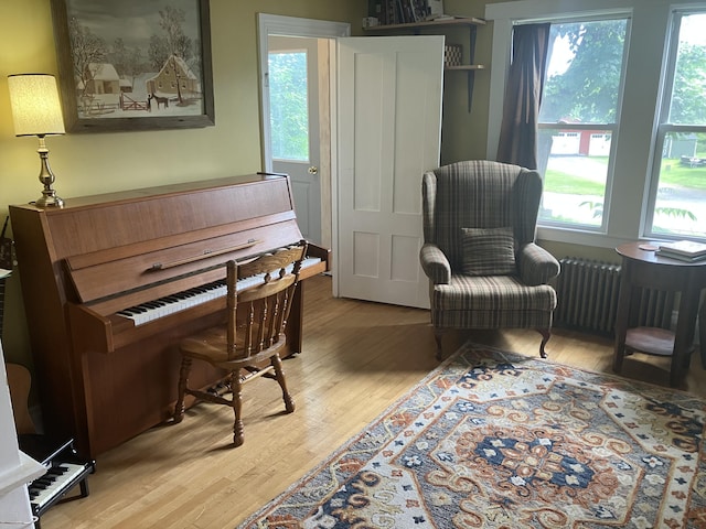 16 N Main St, Morrill, ME 04952 - sitting room featuring wood finished floors, healthy amount of natural light, and radiator