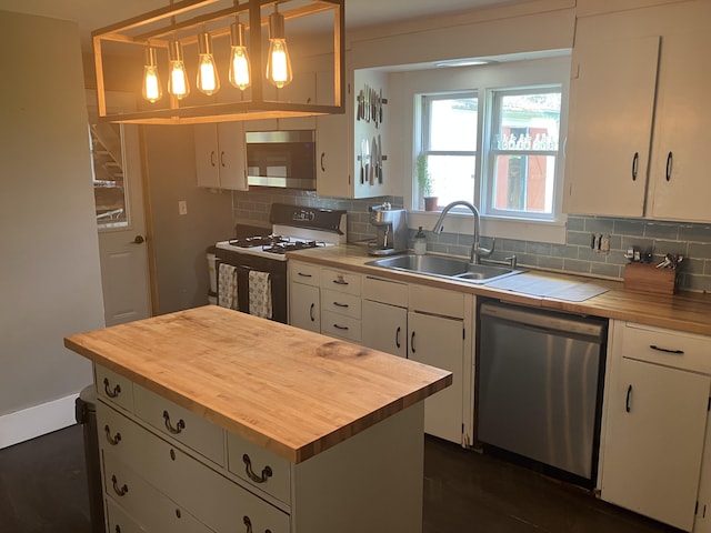 16 N Main St, Morrill, ME 04952 - kitchen featuring stainless steel appliances, wood counters, white cabinetry, and tasteful backsplash