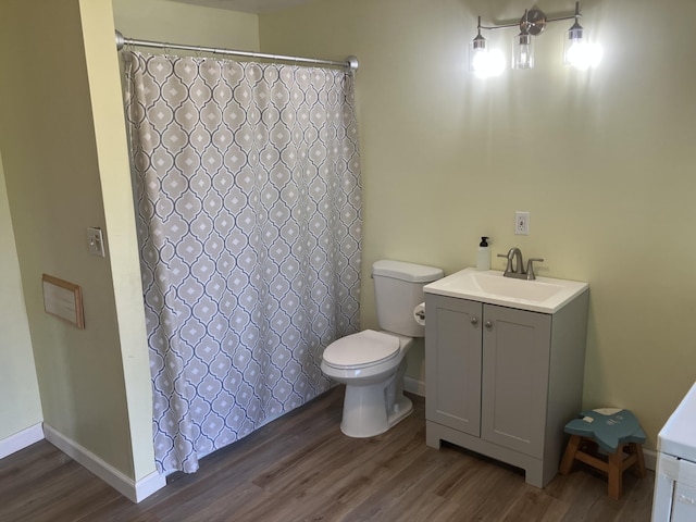 16 N Main St, Morrill, ME 04952 - full bathroom with wood finished floors, vanity, and curtained shower