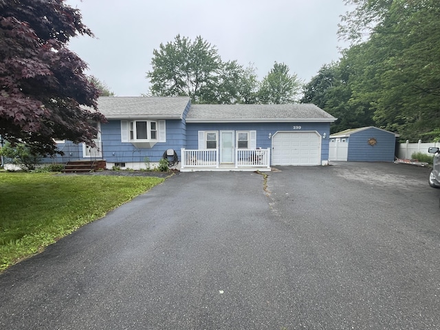 299 County Rd, Westbrook, ME 04092 - ranch-style house with a garage, a front yard, driveway, and roof with shingles