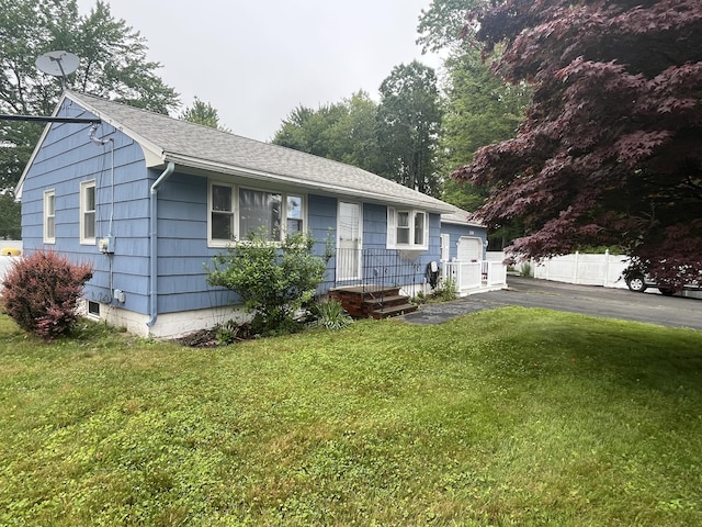 299 County Rd, Westbrook, ME 04092 - view of front facade featuring a front lawn and roof with shingles