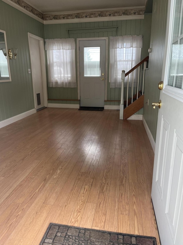 299 County Rd, Westbrook, ME 04092 - entrance foyer with hardwood / wood-style flooring, plenty of natural light, stairway, and crown molding