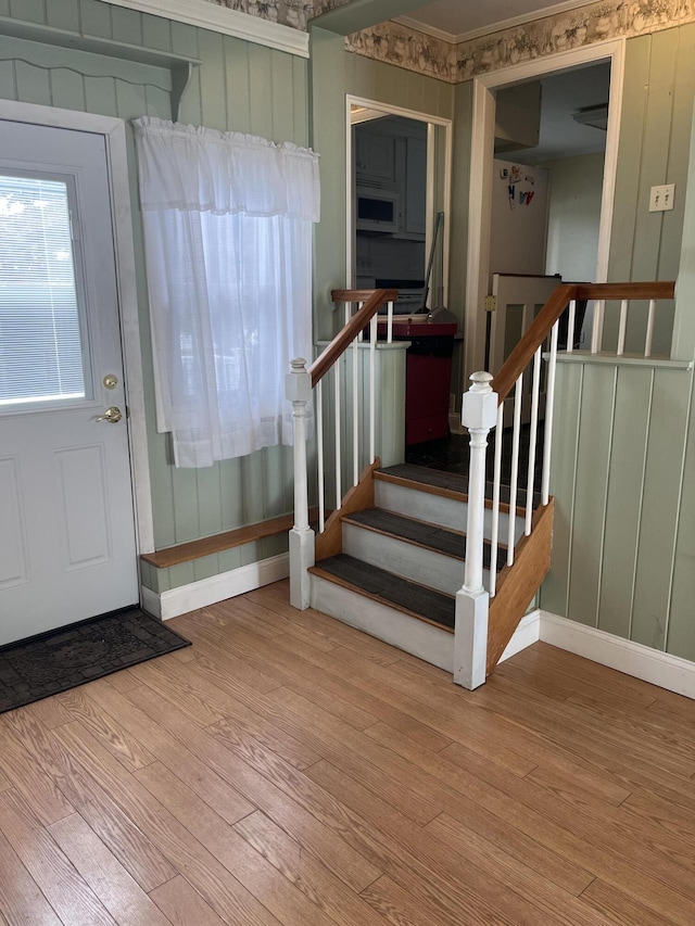 299 County Rd, Westbrook, ME 04092 - foyer featuring wood finished floors, stairs, and crown molding