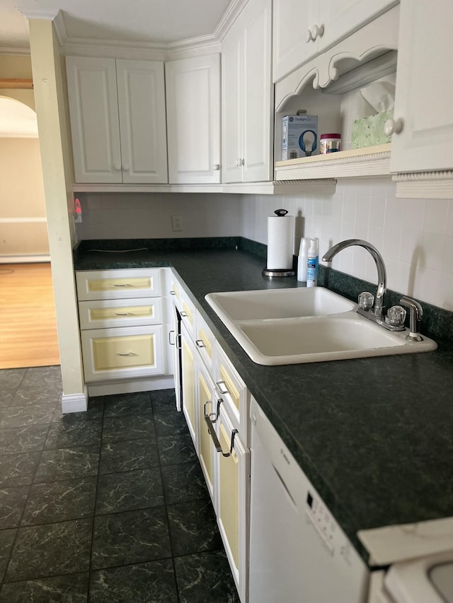 299 County Rd, Westbrook, ME 04092 - kitchen featuring dishwasher, dark countertops, tasteful backsplash, white cabinetry, and arched walkways