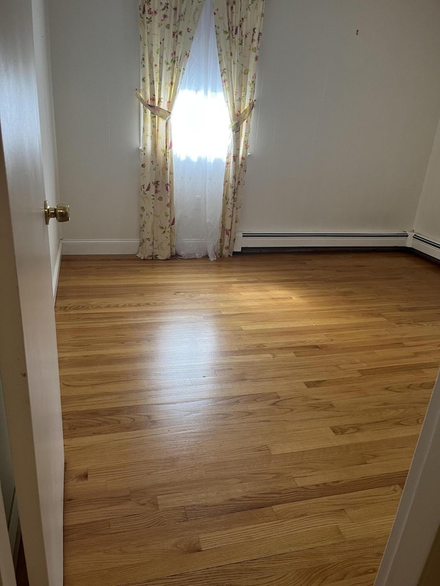299 County Rd, Westbrook, ME 04092 - spare room featuring wood finished floors and baseboards