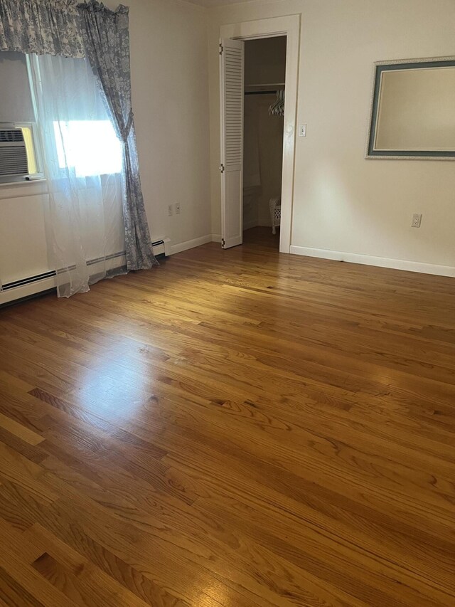 299 County Rd, Westbrook, ME 04092 - unfurnished bedroom featuring wood finished floors and cooling unit