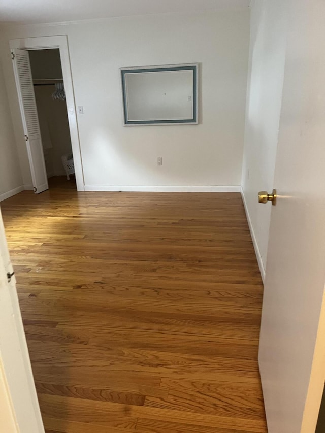 299 County Rd, Westbrook, ME 04092 - unfurnished bedroom featuring wood finished floors and a closet