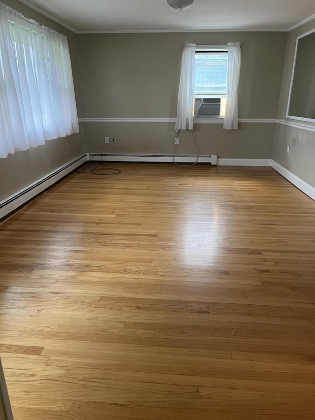 299 County Rd, Westbrook, ME 04092 - empty room with cooling unit, ornamental molding, and wood finished floors