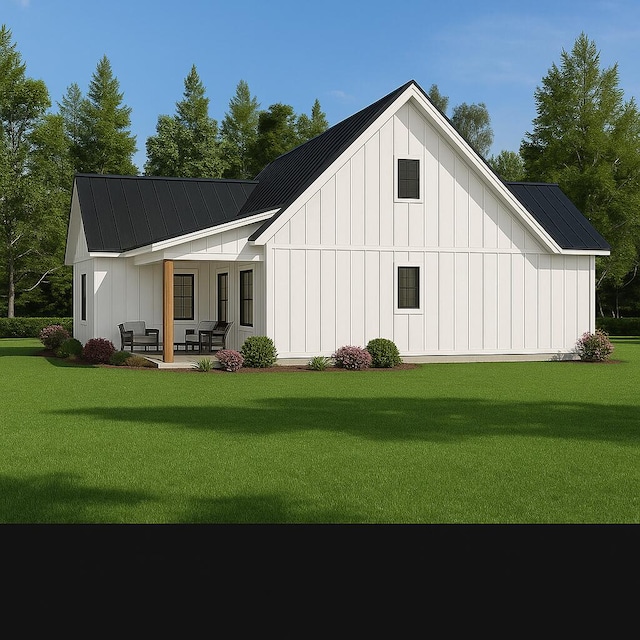 2 Moxie Ln, Biddeford, ME 04005 - back of house with board and batten siding, a yard, a metal roof, and a standing seam roof