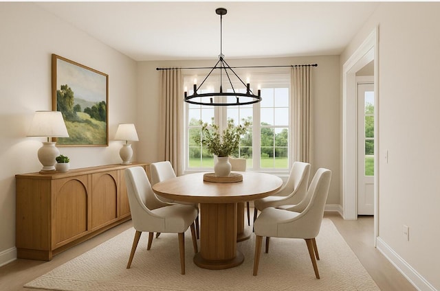 2 Moxie Ln, Biddeford, ME 04005 - dining area featuring a chandelier and baseboards