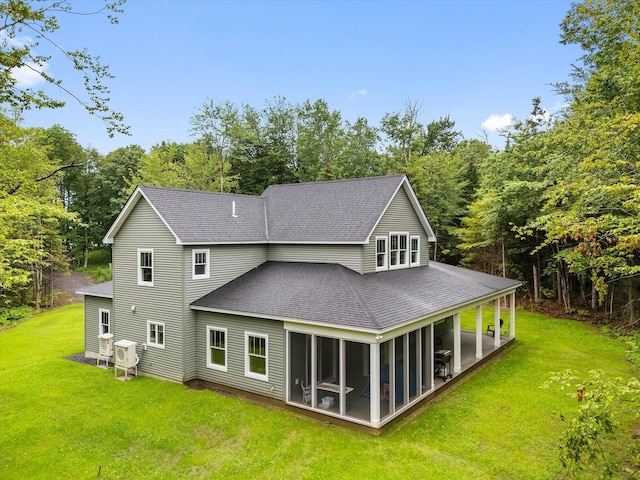 27 Meadow View Dr, Readfield, ME 04355 - back of house with roof with shingles, a yard, and a sunroom