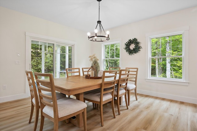 27 Meadow View Dr, Readfield, ME 04355 - dining room featuring a chandelier, healthy amount of natural light, and light wood-style flooring