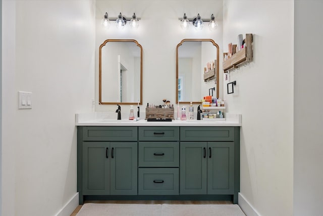 27 Meadow View Dr, Readfield, ME 04355 - bathroom featuring baseboards and double vanity