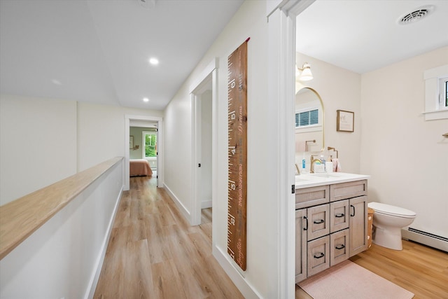 27 Meadow View Dr, Readfield, ME 04355 - hall featuring light wood-style flooring, recessed lighting, and a baseboard heating unit