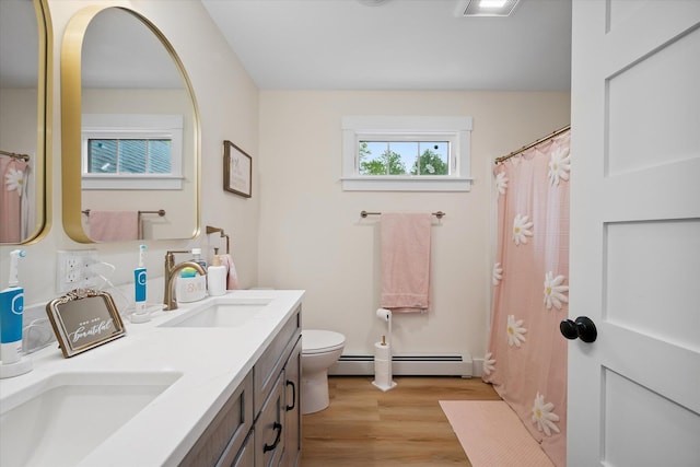 27 Meadow View Dr, Readfield, ME 04355 - bathroom with a baseboard radiator, wood finished floors, double vanity, and a shower with curtain