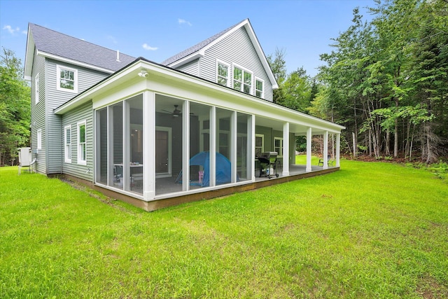 27 Meadow View Dr, Readfield, ME 04355 - back of property featuring a sunroom, a yard, and a shingled roof