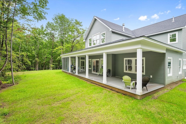27 Meadow View Dr, Readfield, ME 04355 - back of house featuring a yard, a patio, and roof with shingles
